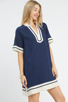 Three quarter angled view of navy contrast trim linen mini dress with relaxed shift silhouette, AVAH
