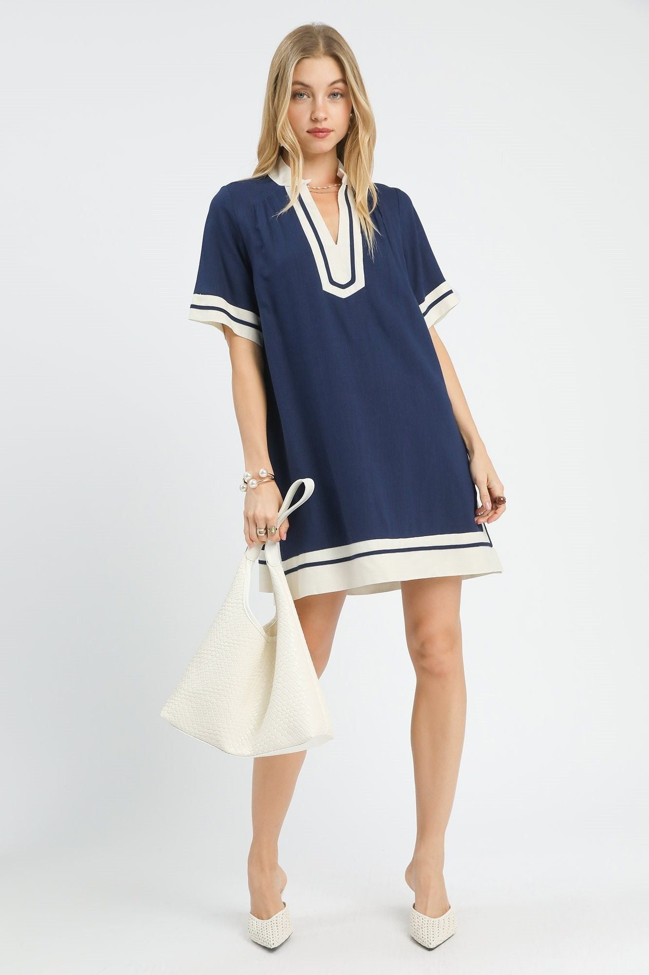  Full length front view of navy linen mini dress with contrast striped cuffs and hem border, AVAH
