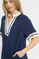 Close detail of Yacht Club Linen Mini Dress showing contrast neckline and striped sleeve cuff, AVAH