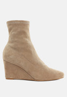 Beige microfiber ankle boot on a white background
