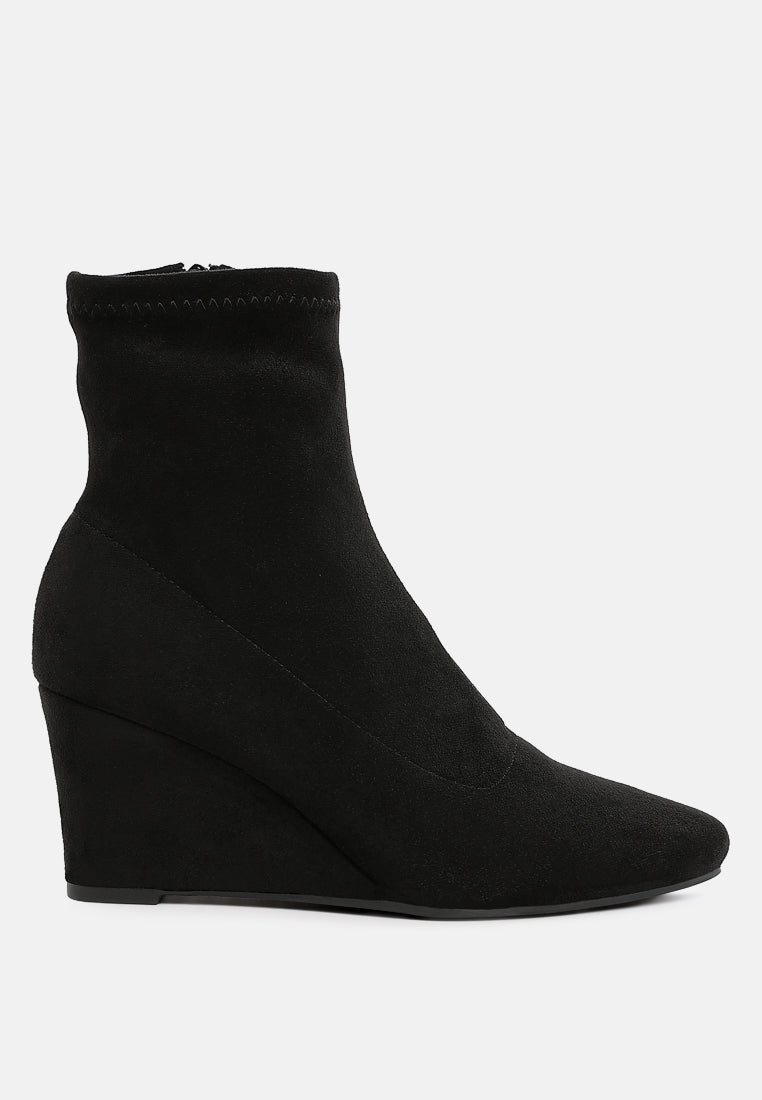Balck microfiber ankle boot on a white background