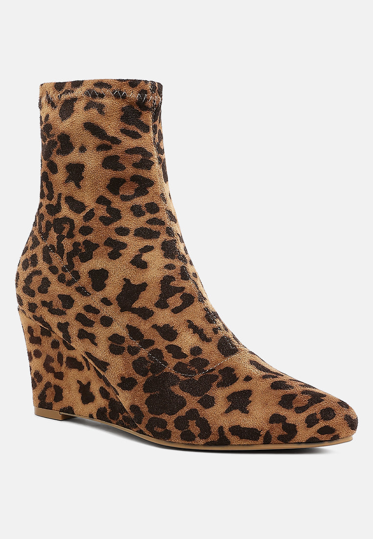 Leopard print microfiber ankle boot on a white background