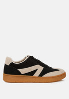 Black and beige sneaker with a Union Jack design on a white background
