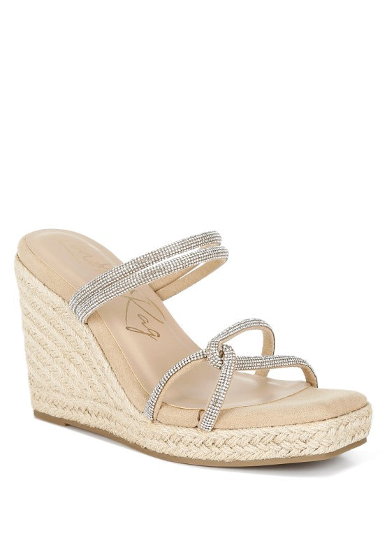 Blush wedge sandal with rhinestone straps on a white background