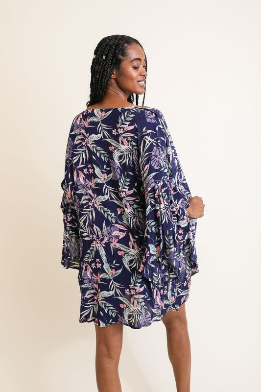 Back view of navy kimono with pastel floral leaf print, styled with a relaxed silhouette.