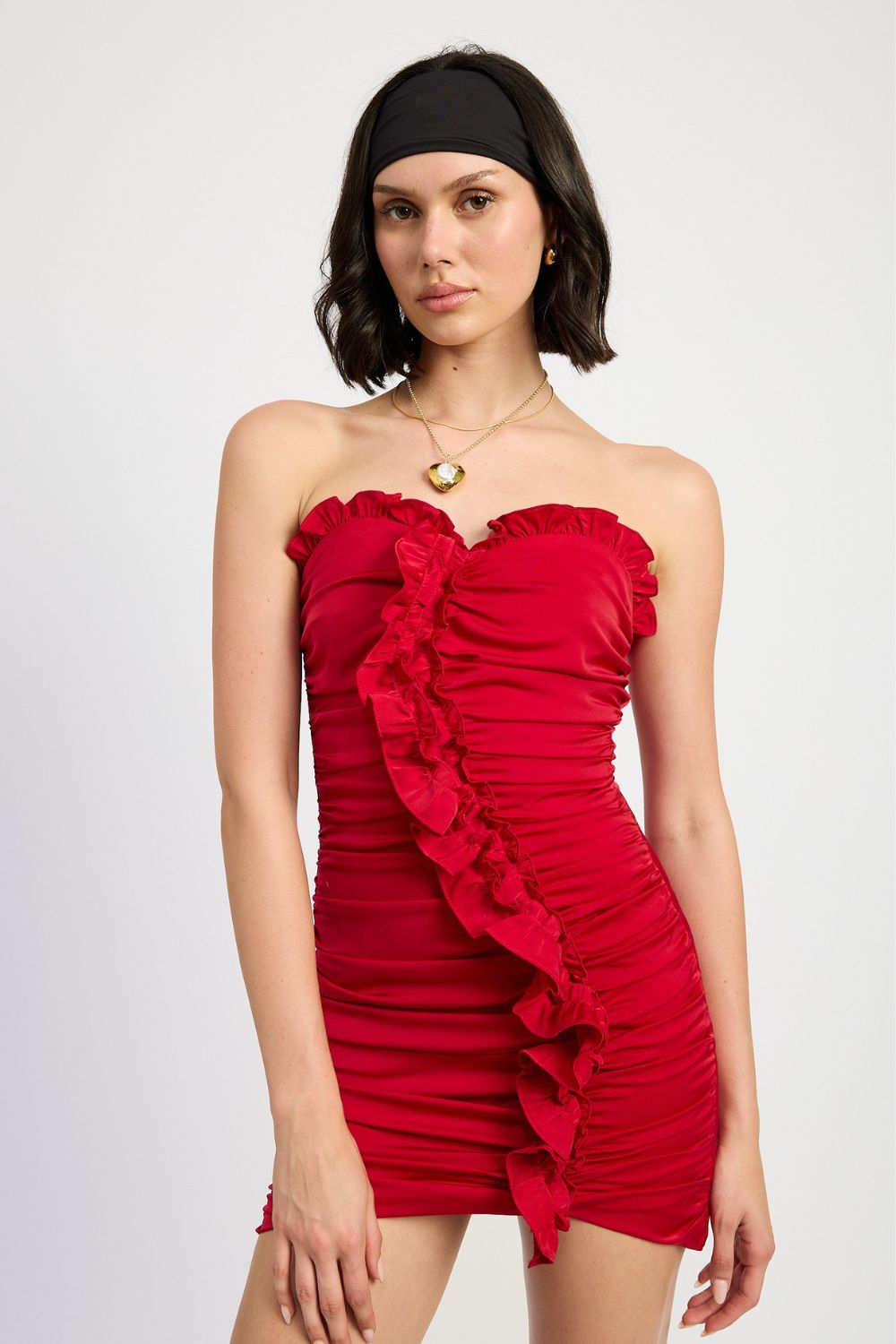 Model wearing a red ruffled date night dress styled for Valentine looks
