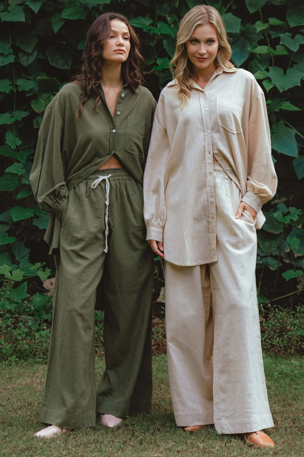 Two women wearing olive green and cream Bali ELF matching sets