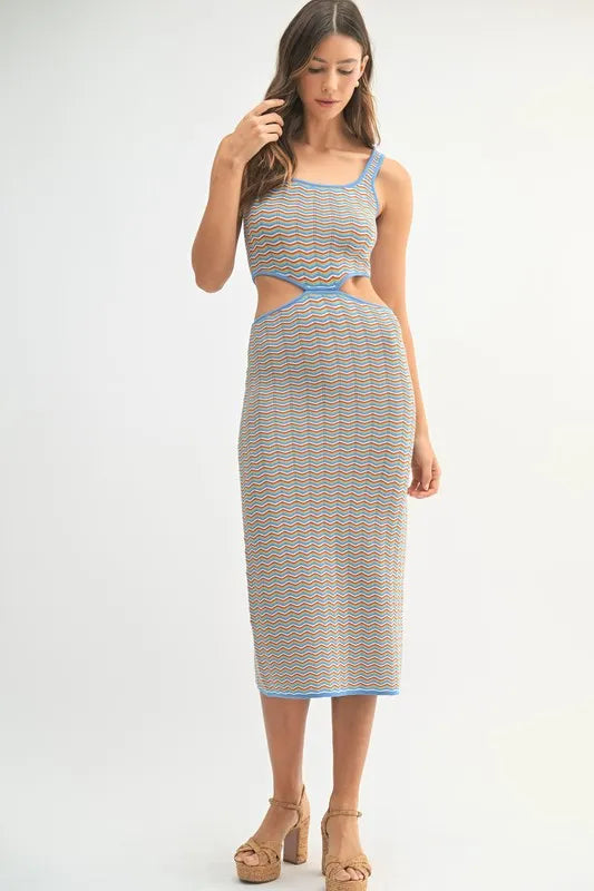 Full length view of striped cutout midi dress with platform heels
