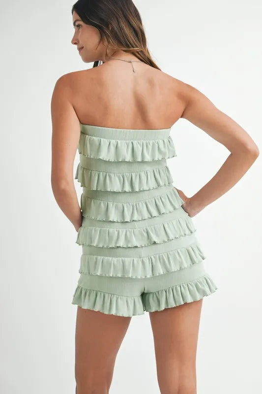Back view of sage green smocked romper
