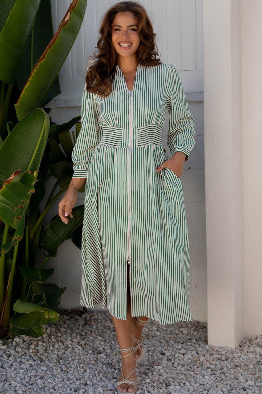 Front view of model wearing green and white striped zipper-front midi dress with belted waist and long sleeves.