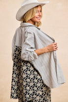 Side and back view of Florence Mixed Print Button Down Shirt showing striped upper panel and contrasting floral lower section.