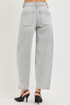 Back view of grey barrel leg jeans with patch back pockets and contrast stitching, AVAH