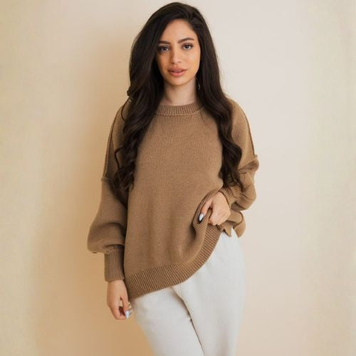 Model in a camel oversized knit sweater styled with white pants, cozy winter basics – AVAH.