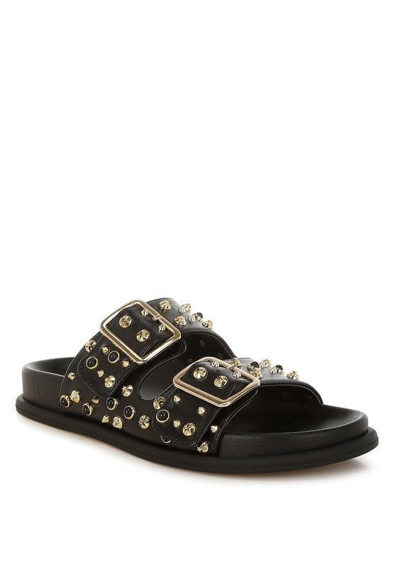 Black studded faux leather slide sandal with gold buckles and double strap detail, side angle-AVAH