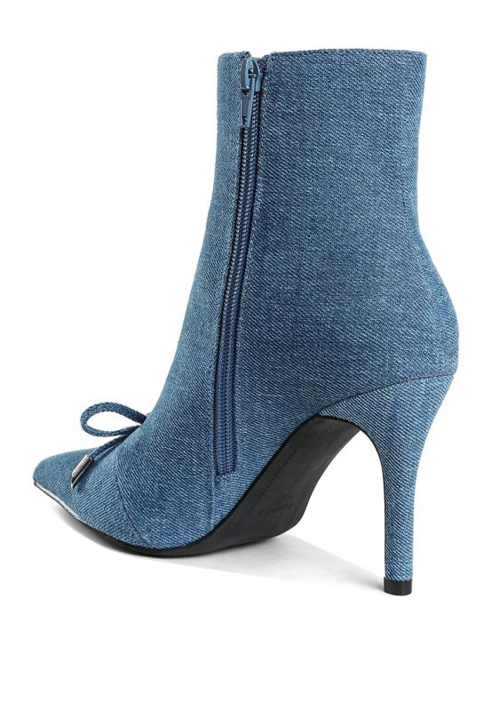 back angled view of denim stiletto boot showing zipper closure
