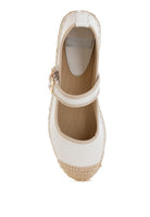 Overhead view highlighting white leather and woven espadrille texture