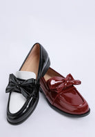 two-tone black/white and red patent loafers side by side-AVAH