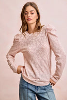 Blush Bloom Puff Sleeve Top with raised floral texture, long sleeves and gathered puff shoulders styled with jeans.