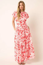 Coral floral maxi skirt set back view featuring a tied waist detail and tiered skirt silhouette.
