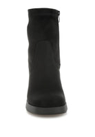 Front view of black platform boot showing round toe design.