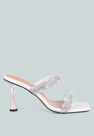 White high-heeled sandal with metallic heel, rhinestone details, and square toe on a white background, side view