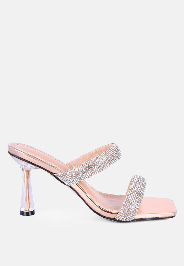 Pink high-heeled sandal with metallic heel, rhinestone details, and square toe on a white background, side view