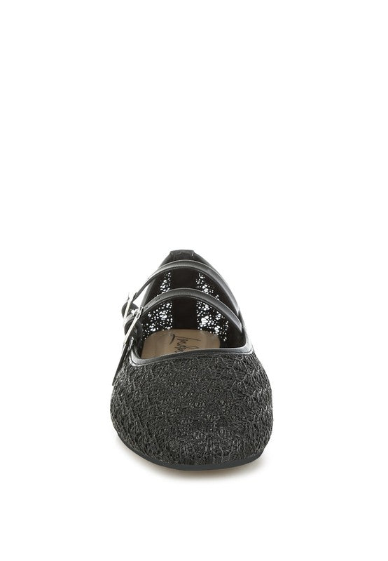 Black ballet flats with double buckle straps, made from raffia and faux leather-front view