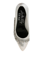 Top view of white satin pointed-toe heel with crystals
