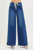  Front view of wide leg drawstring jeans with raised seam detail in indigo wash, AVAH