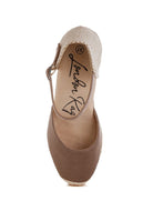 Taupe espadrille sandal showcasing cushioned footbed and textured woven heel – top view
