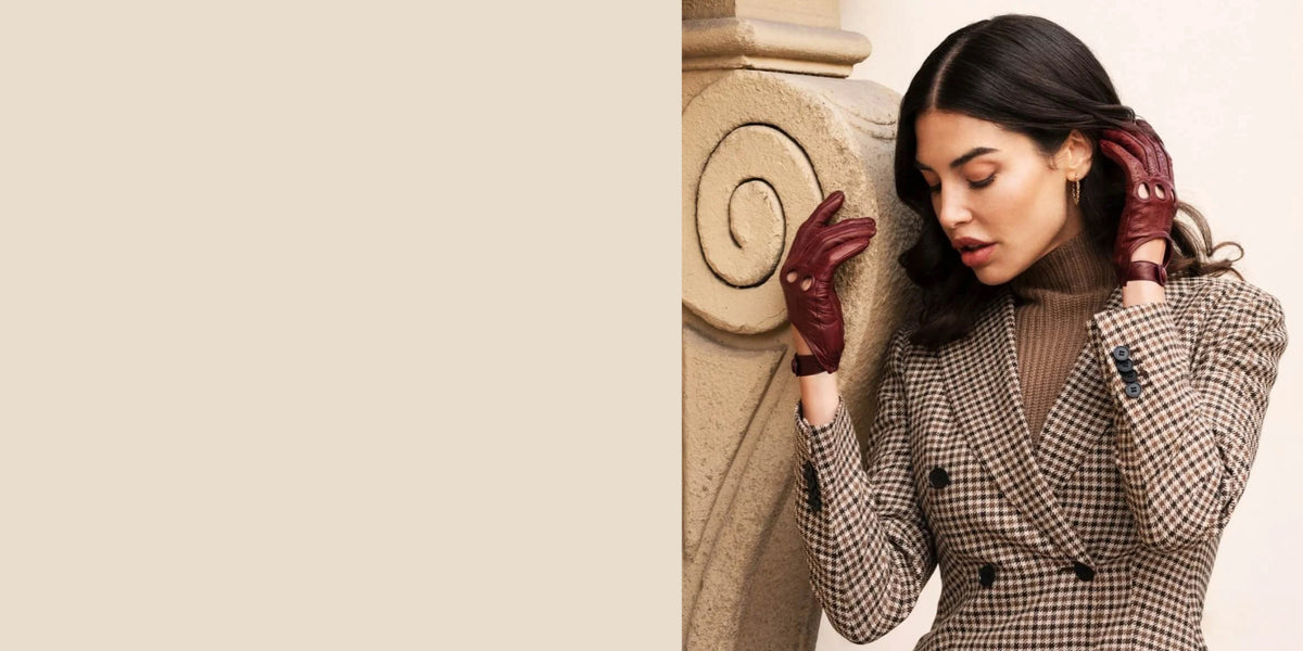 Woman wearing burgundy Fratelli Orsini Italian leather driving gloves