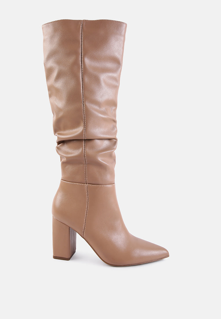 Tan knee-high boot on a light gray background