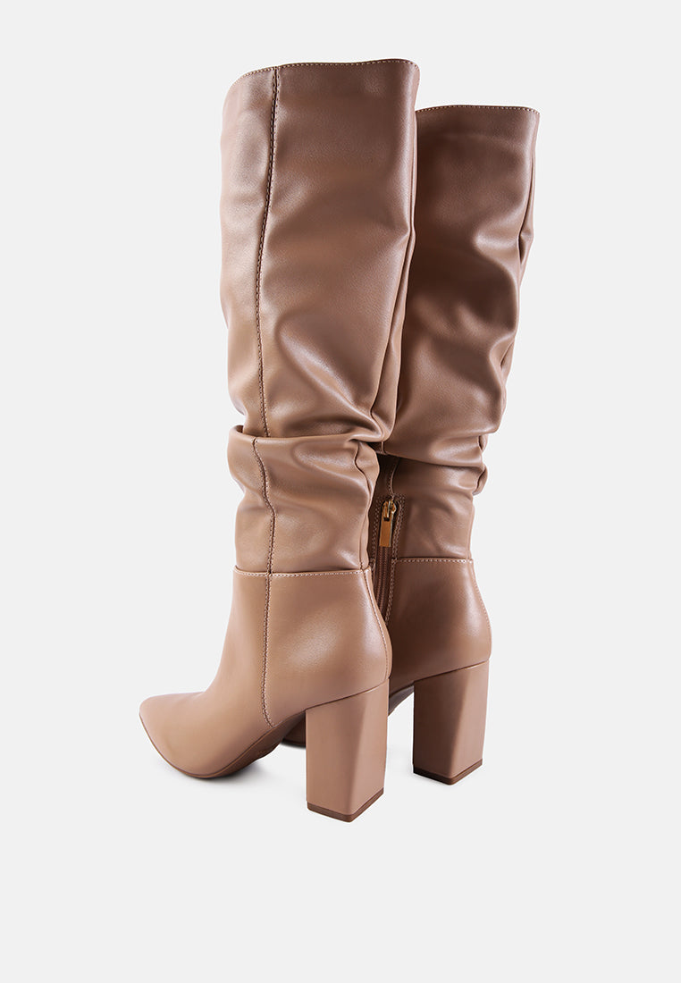 Pair of brown knee-high boots on a white background