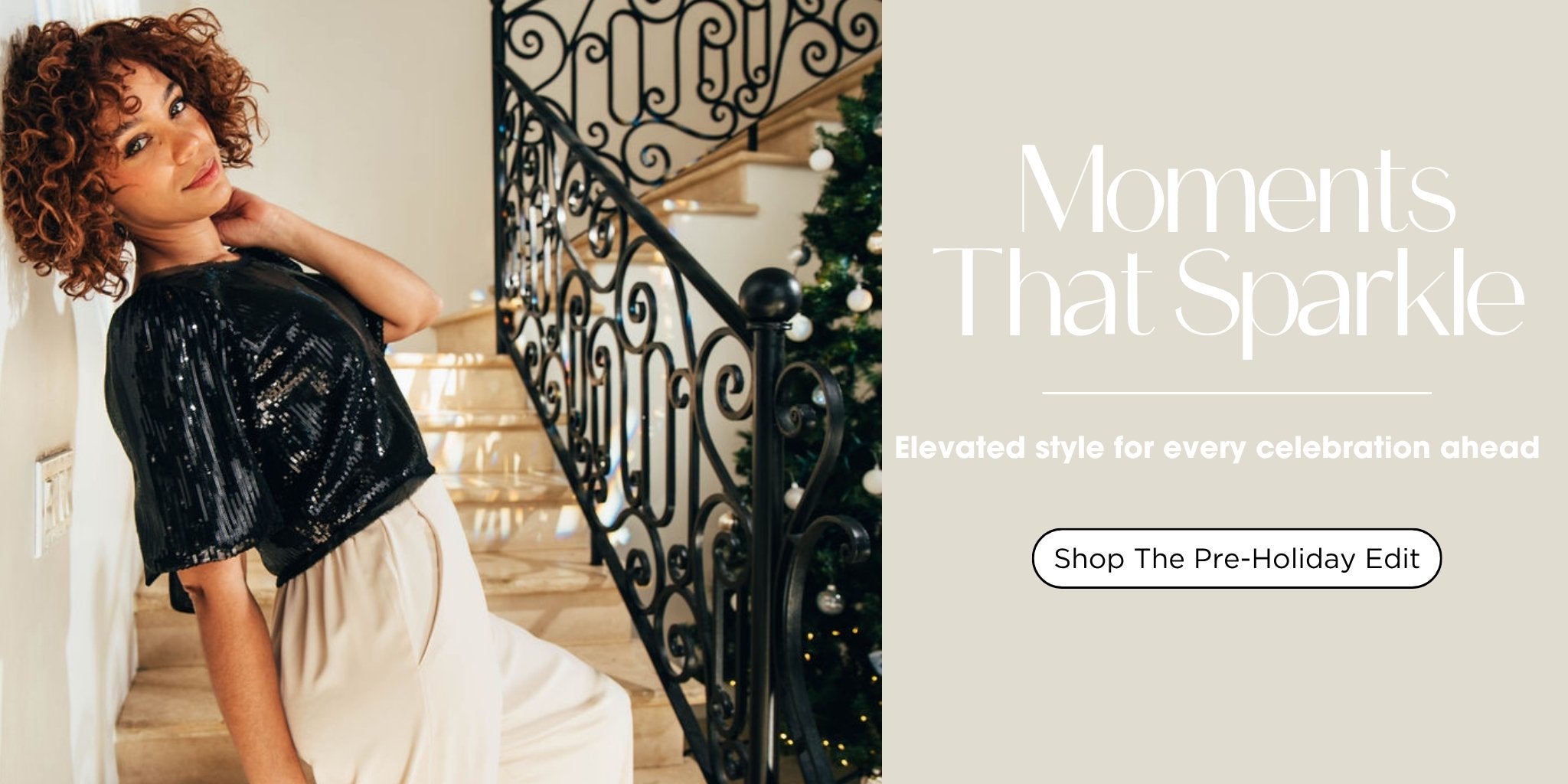 AVAH holiday fashion banner featuring a model in a black sequin top on a staircase with a Christmas tree, showcasing elegant women’s outfits for the Pre-Holiday Edit.