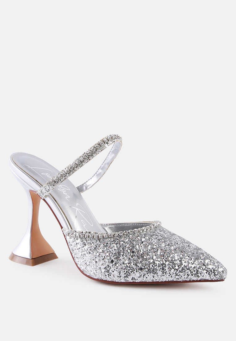 Silver Glitter mules with rhinestone embellishment, sculpted heel, pointed toe and crystal decorated elastic strap