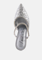 Silver Glitter mules with rhinestone embellishment, sculpted heel, pointed toe and crystal decorated elastic strap top view