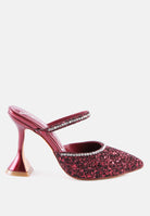 Wine color glitter mules with rhinestone embellishment, sculpted heel, pointed toe and crystal decorated elastic strap Side view