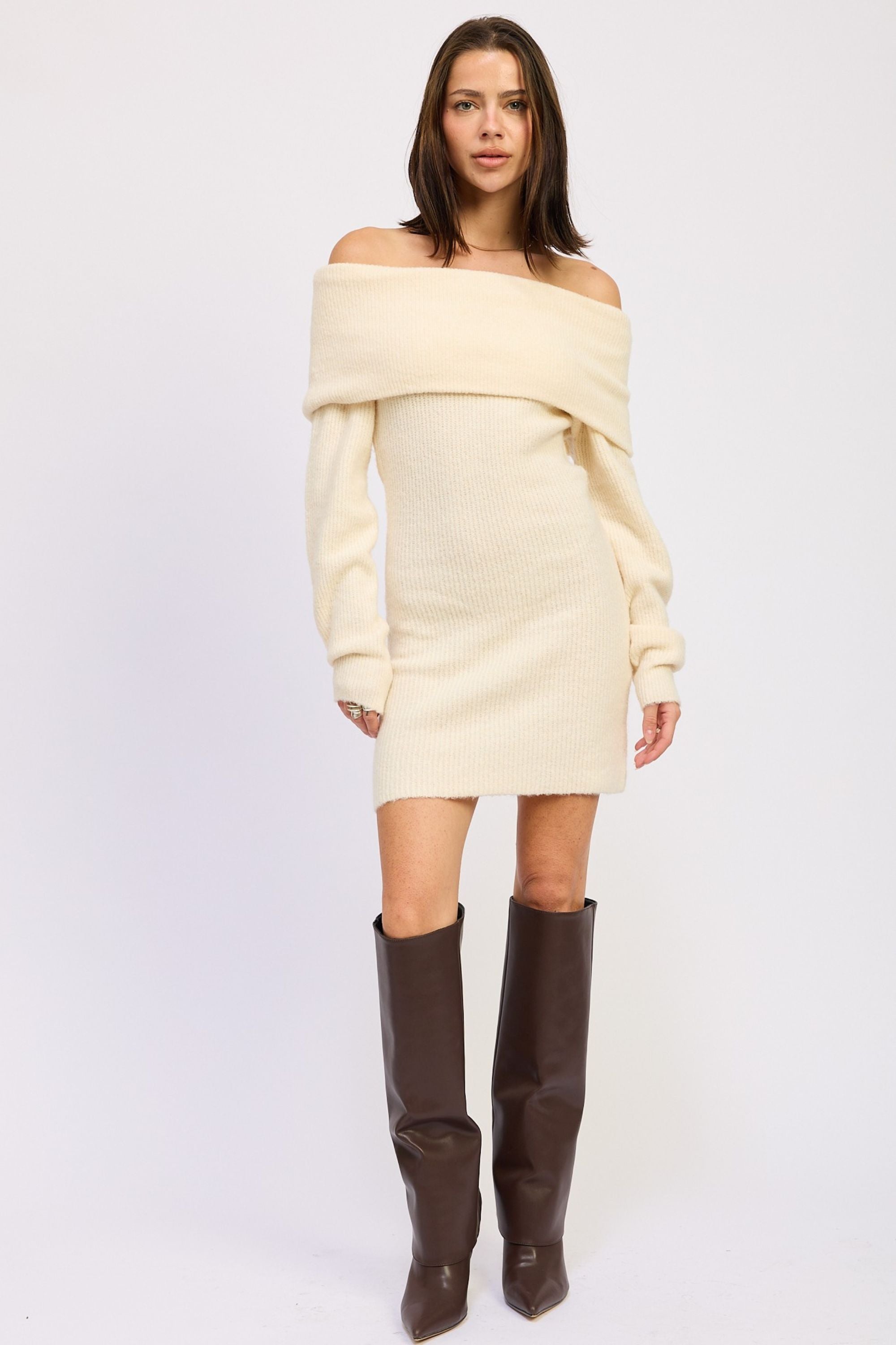 AVAH Sweaters & Knits banner featuring an off-shoulder cream knit sweater dress styled with tall boots, cozy women’s fall knitwear