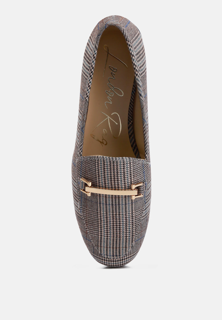 Textured loafers with a gold accent on a white background top view
