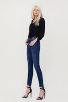 These jeans are cut from comfy stretch denim to sit on your hips and have a high rise that creates a smooth, sculpted shape. We love the ankle skinny fit and uneven hem, perfect to show off your favorite pair of shoes! Avah Couture