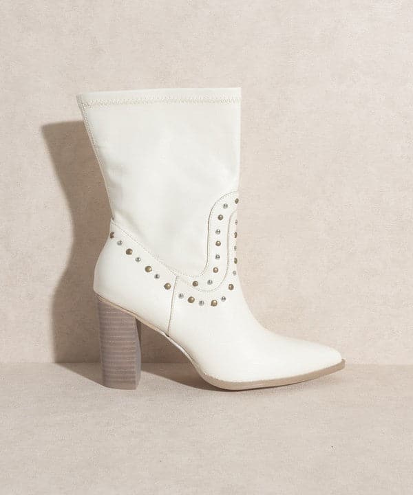 Are you ready for the streets of Paris? If yes, then slip on these high cut western boots that are embellished with studs. The Paris Awaits is a short boot with a heel that adds height to your step and completes an overall edgy look.