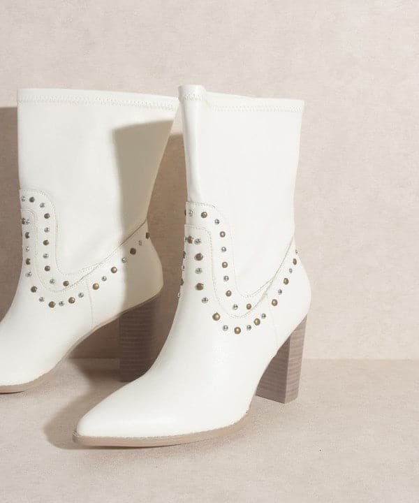 Are you ready for the streets of Paris? If yes, then slip on these high cut western boots that are embellished with studs. The Paris Awaits is a short boot with a heel that adds height to your step and completes an overall edgy look.