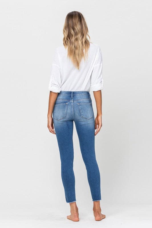 These mid-rise skinny jeans like to keep things simple. Crafted from premium stretch denim for a super comfy and flattering fit, featuring an ankle grazing crop length and raw hemline. This modern style will look amazing with anything from flats and sneakers to boots and heels. Avah Couture