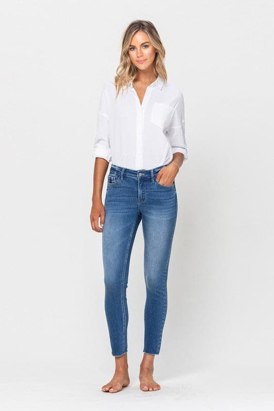 These mid-rise skinny jeans like to keep things simple. Crafted from premium stretch denim for a super comfy and flattering fit, featuring an ankle grazing crop length and raw hemline. This modern style will look amazing with anything from flats and sneakers to boots and heels. Avah Couture