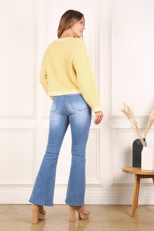 This timeless crew neck sweater with long sleeves will be your go to for years to come in its classic design and comfy fit. The herringbone pattern makes it an excellent piece for dressing up, or down. Avah Couture