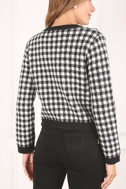 A classic piece that has timeless style, the Black And White Check Jacket is a must have this season. The heavy weight knit fabric features a black and white check pattern that gives it its name. A perfect balance of comfort and style, this jacket features 4 front snap buttons and 2 functional pockets. Wear it with your favorite outfit to work or play a classic piece to get you through any occasion! Avah Couture