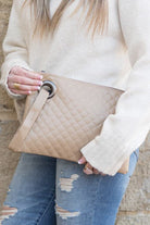 Classic and timeless, this beautifully quilted design clutch will be your go to bag. You’ll love it so much you’ll want one in every color! Made with a premium soft quilted PU leather and cotton Herringbone print lining and complete with grommet detail and wristlet. Avah Couture