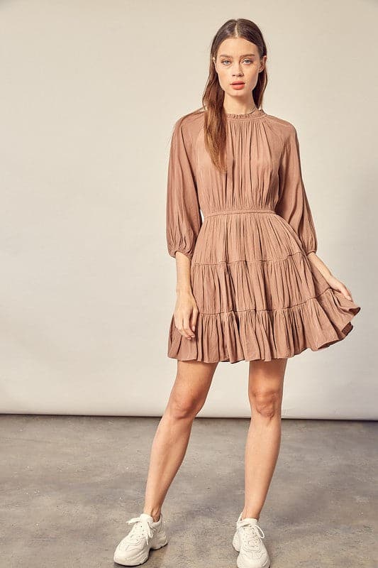 A feminine, comfy and stylish dress that makes you feel cute from top to bottom. The 3/4 sleeve, tiered skirt and ruffle detail make this dress perfect for any occasion. Style this dress with boots or heels for day wear or a night out on the town.  Avah Couture