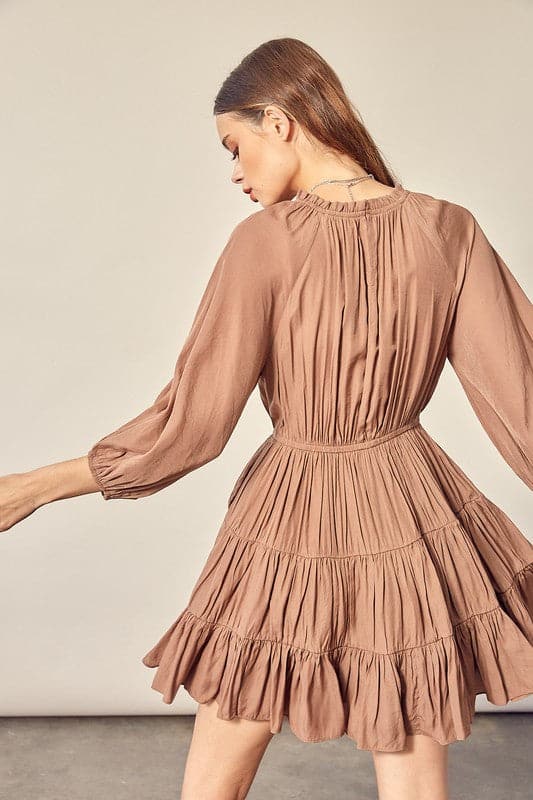 A feminine, comfy and stylish dress that makes you feel cute from top to bottom. The 3/4 sleeve, tiered skirt and ruffle detail make this dress perfect for any occasion. Style this dress with boots or heels for day wear or a night out on the town.  Avah Couture