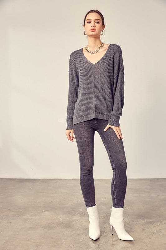 This comfy v neck knit top is the perfect transitional pice for all your fall outfits. Layer it over a cozy tank top and jeans or shorts for the weekend, or under a jacket when the fall weather settles in. This easy to style, chic knit pullover will look great with any wardrobe. Avah Couture